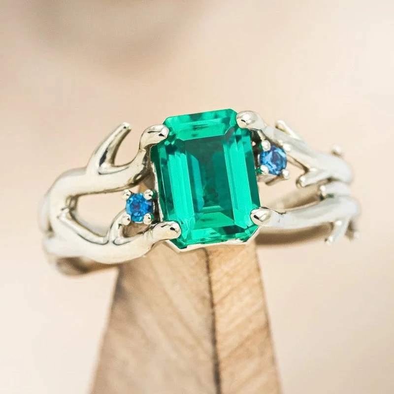 "ARTEMIS" - EMERALD CUT LAB-GROWN EMERALD ENGAGEMENT RING WITH SAPPHIRE ACCENTS