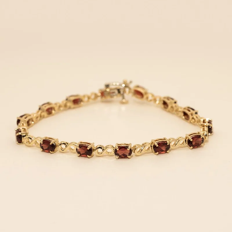 Estate Oval Garnet Infinity Link Bracelet in 14kt Yellow Gold